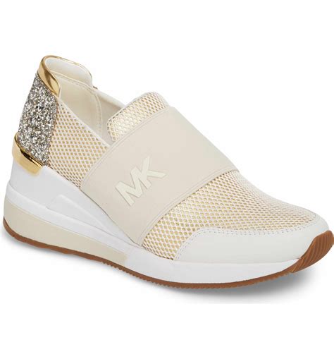 ladies michael kors sneakers|Michael Kors slip on sneakers.